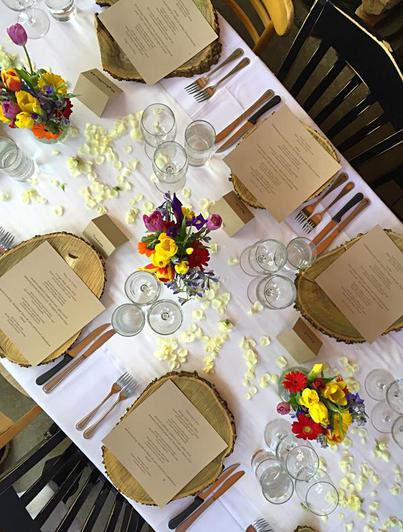 An overhead view of Potager private-event place settings, flowers, and greenery