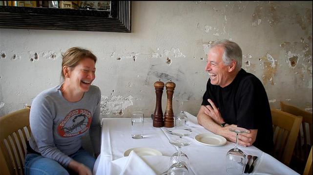 Potager founder Teri Rippeto smiling at a table with her father, Tom, in an archival photograph